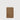 Close-up of a tan leather cardholder with a minimalist design and a rounded edge